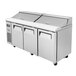 A Turbo Air 3 door stainless steel refrigerated sandwich prep table.