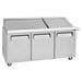 A Turbo Air stainless steel 3 door mega top sandwich prep table.