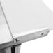 A Turbo Air stainless steel sandwich prep table with a white surface and metal handle.