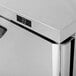A Turbo Air Super Deluxe worktop freezer with a stainless steel exterior on a counter in a professional kitchen.