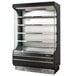 A black and silver Turbo Air refrigerated air curtain merchandiser.