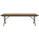 A Correll rectangular folding table with a medium oak wooden top and metal frame.