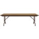 A Correll medium oak rectangular folding table with a metal frame.