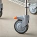 A Metro PrepMate Multistation cart with a Metro 5" locking caster wheel.