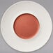 A white Villeroy & Boch porcelain coupe plate with a copper circle in the middle.