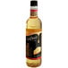A close up of a DaVinci Gourmet Classic Cheesecake flavoring syrup bottle with a black cap.