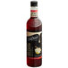 A close up of a bottle of DaVinci Gourmet Classic Cake Batter flavoring syrup with a black cap.