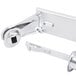 A chrome San Jamar double roll toilet paper holder with a latch.