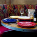 A table set with Tuxton Concentrix plates and wine glasses.