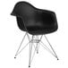 a black plastic chair with metal legs