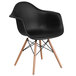 a black chair with wooden legs