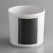 A white melamine round utensil holder with a black label.