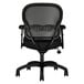 A back view of a black HON Wave mesh mid-back office chair with arms and wheels.