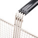 A Cecilware full size metal fryer basket with black handle.