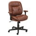 A brown leather OIF office chair with black wheels.