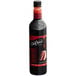 A bottle of DaVinci Gourmet Classic Red Velvet Cake flavoring syrup with dark liquid inside.