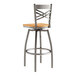 A Lancaster Table & Seating metal bar stool with a natural wood seat and a clear coat finish.