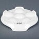 a white ceramic egg holder