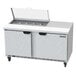 A Beverage-Air refrigerated sandwich prep table with two doors open.
