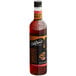 A close-up of a DaVinci Gourmet Classic Coffee Liqueur Flavoring Syrup bottle filled with brown liquid.