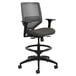 A black office task stool with a grey seat and backrest.