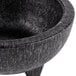 A black polypropylene Molcajete bowl with a handle.