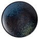 A blue and black Playground stoneware plate with a speckled design.
