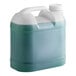 A plastic jug of green liquid with a white lid.