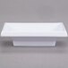 A white rectangular GET Water Lily melamine sauce dish.