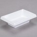 A white rectangular GET Water Lily melamine sauce dish.