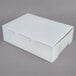 A white cupcake box with a lid.