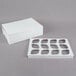a white box with a lid and a piece of paper
