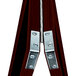 A close-up of a metal corner clamp on a wood frame.