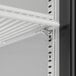 A close-up of a Beverage-Air Marketeer Series shelf with a metal bracket.