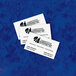 Several Avery Linen Matte White business cards with the words "corporate intelligence" on a blue surface.