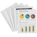 A group of Avery White Sliding Bar Report Covers on white paper with charts and graphs.