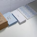 A box of white Avery shipping labels with a close-up of the box.