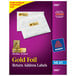 A package of Avery gold foil rectangle return address labels on a purple box of white envelopes.