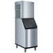 A silver Manitowoc air cooled flake ice machine with a black lid.