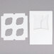 A white square box with a reversible insert with 4 circles.