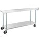 A silver metal Regency commercial work table with wheels.