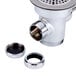 A stainless steel T&S twist waste valve with a drain cover over two holes.