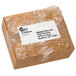 A brown box with a white Avery mailing label with ice on it.
