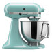 Aqua blue KitchenAid Artisan stand mixer with silver bowl.