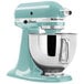 Aqua blue KitchenAid Artisan Series stand mixer with bowl attachment.