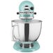 Aqua blue KitchenAid Artisan stand mixer with a silver bowl.