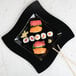 a plate of sushi on a marble surface