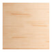 A close up of a Lancaster Table & Seating live edge wood table top with a bleached oak finish.