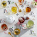 A glass of Numi Organic Rooibos Tea with a tea bag in it on a table.