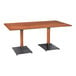 A Lancaster Table & Seating wooden table with black legs.